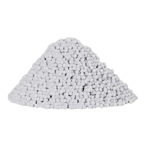Pile of white zazen Water Alkalinity Enhancer beads on a white background.